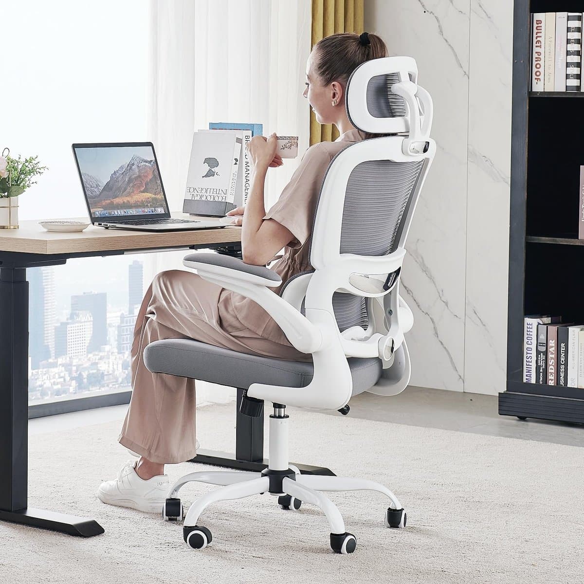 White ergonomic mesh office chair at a home office desk