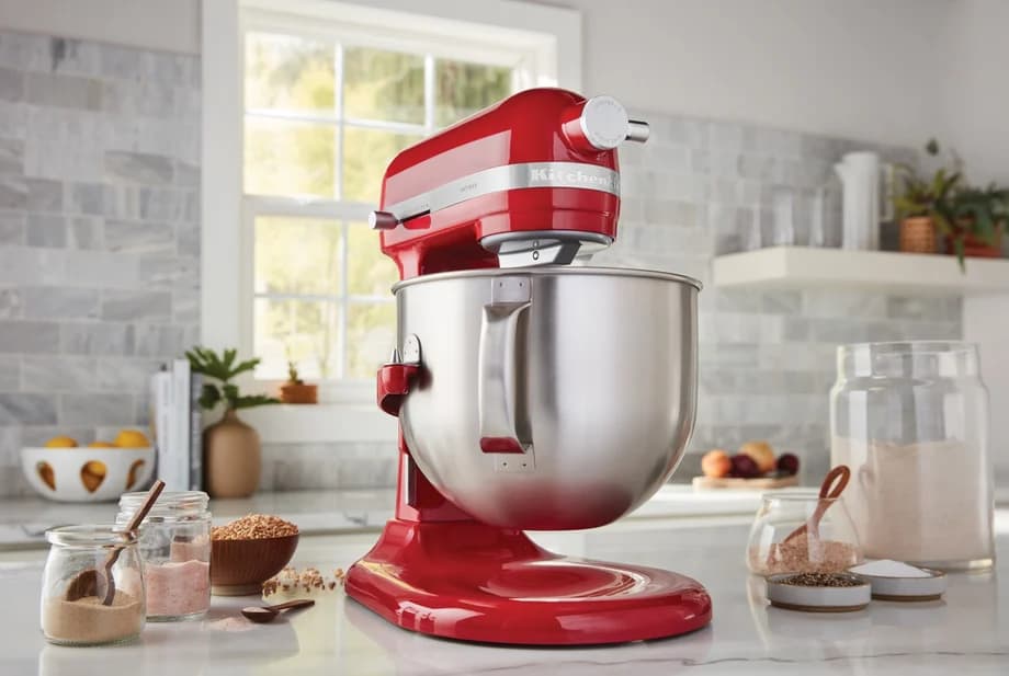 Red stand mixer with stainless bowl